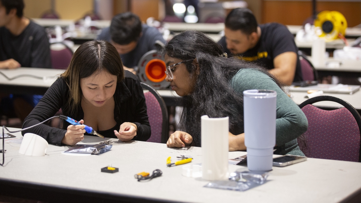 University students training on integrated circuits in a microelectronics lab